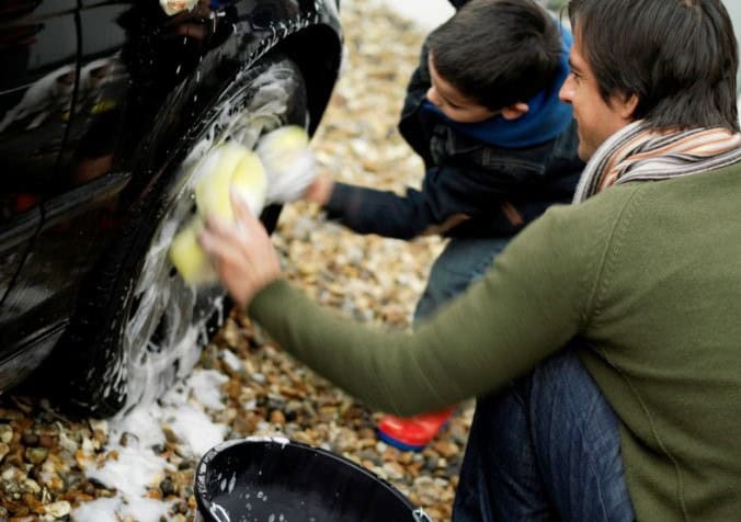 family doing a car cleaning
